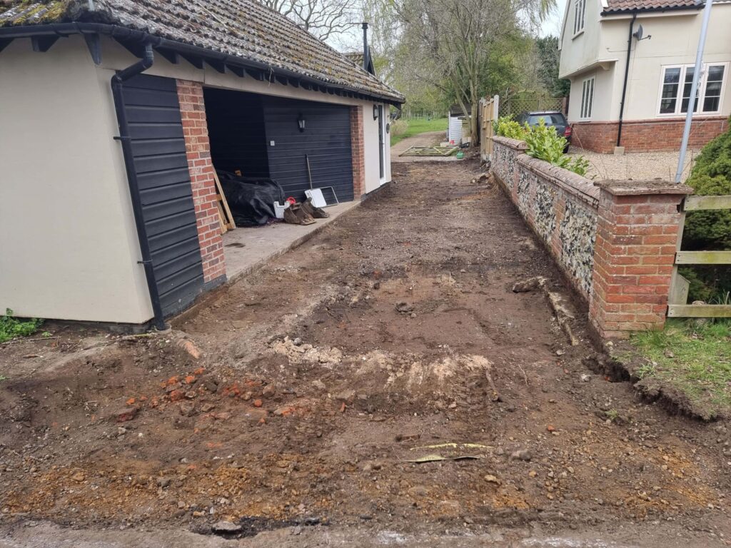 This is a tarmac driveway that is in the process of being dug by Ely Driveways